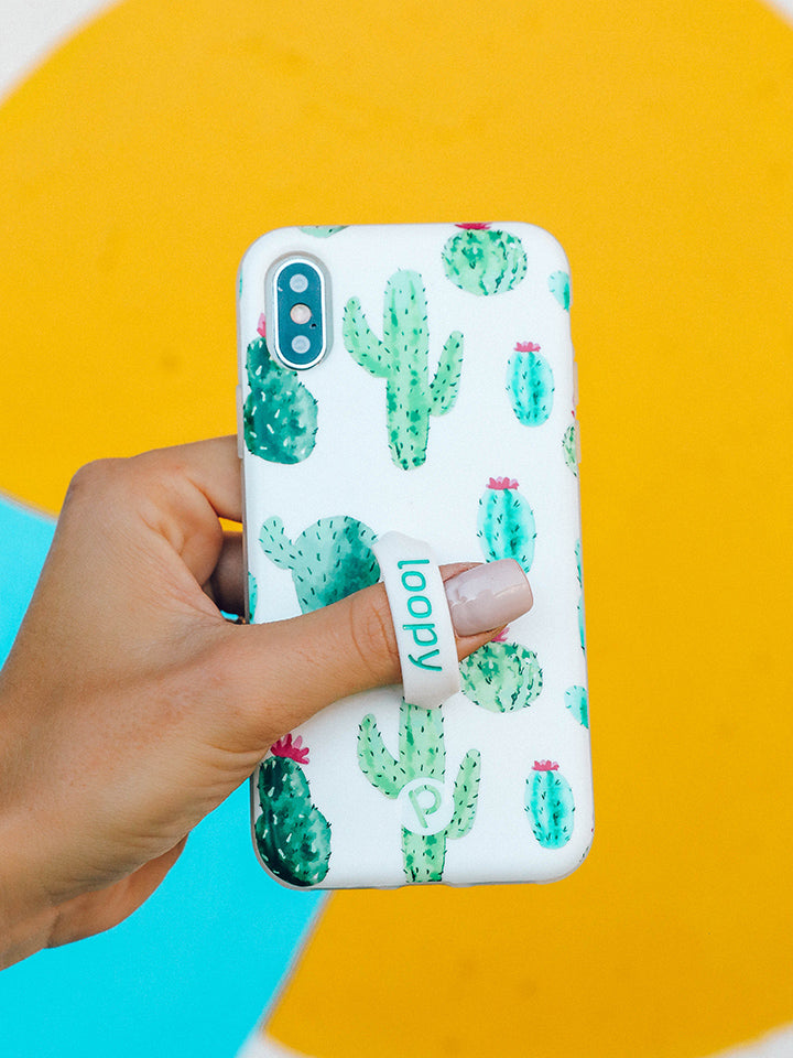 A woman holding a Cactus Loopy Case.|| feature-media