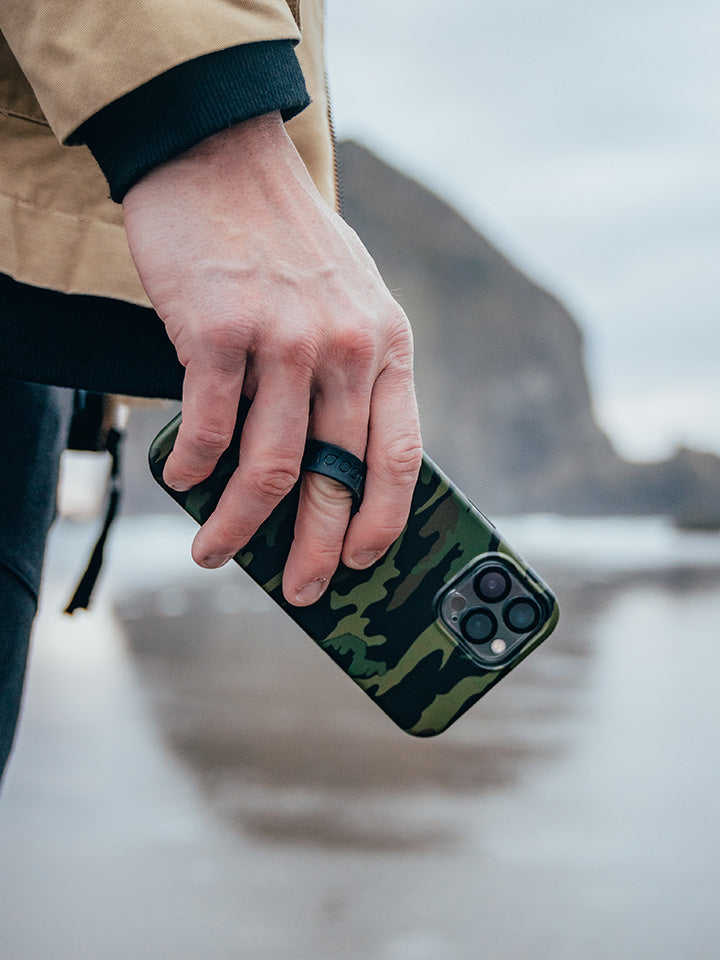 A man holding a Camo Loopy Case.|| feature-media