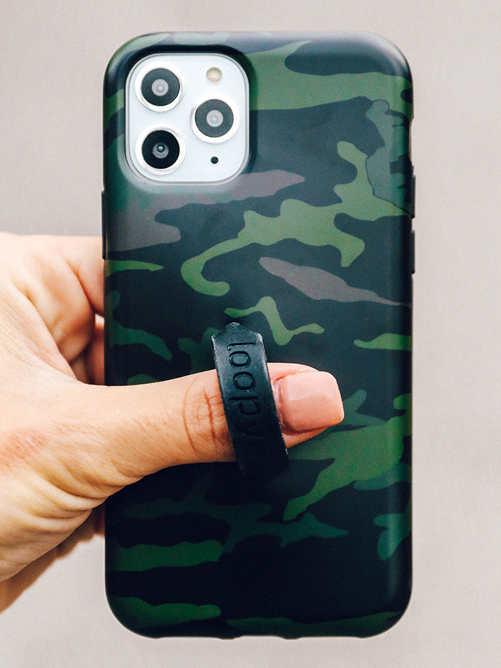 A woman holding a Camo Loopy Case.|| feature-media