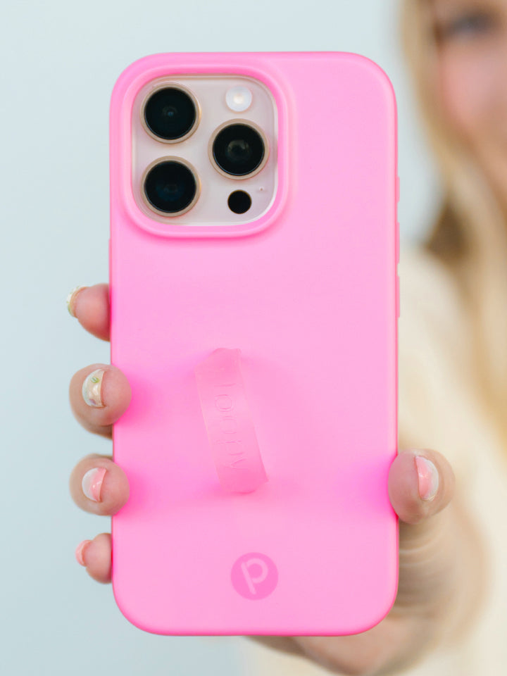 A woman holding a Berry Pink Loopy Case. || feature-media