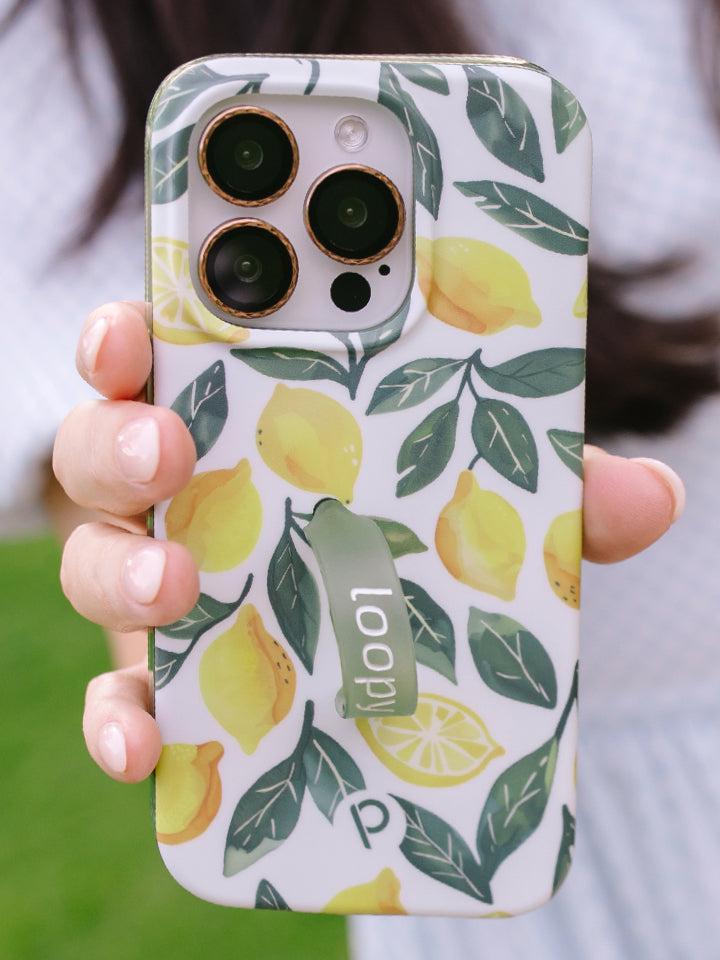 A woman holding a Lemon Grove Loopy Case. || feature-media
