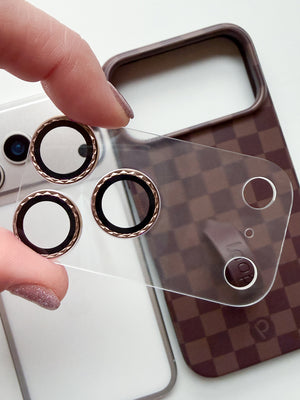 A woman holding a Loopy Cases Clear with Diamond Desert Titanium Full Camera Tempered Glass. || feature-media