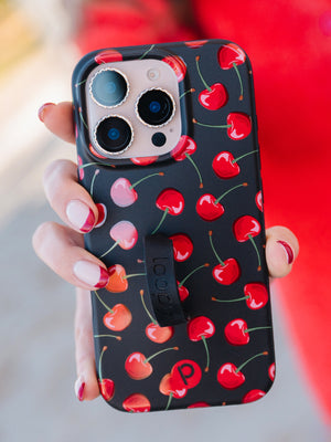 A woman holding a Black Cherry Loopy Case. || feature-media
