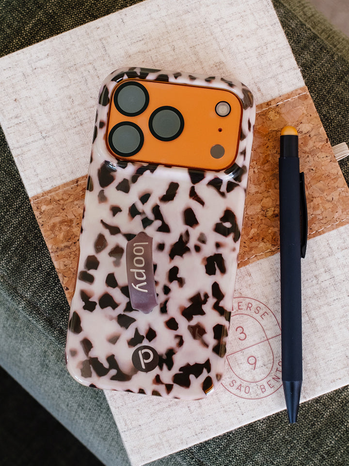 A Blonde Tortoise Loopy Case on a journal. || feature-media