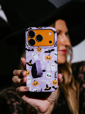 A woman holding a Boo Crew Loopy Case. || feature-media