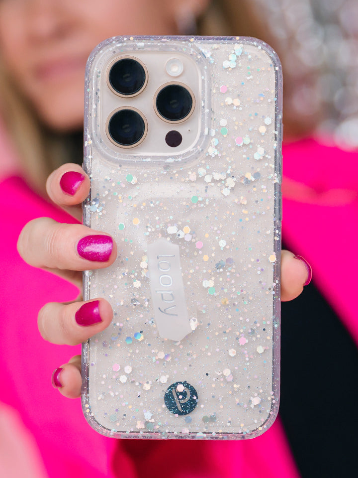 A woman holding a Cosmic Confetti Loopy Case. || feature-media