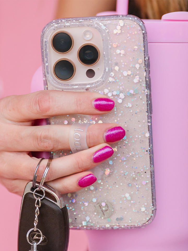A woman holding a Cosmic Confetti Loopy Case. || feature-media