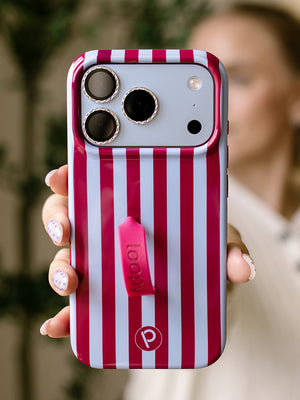 A woman holding a Cranberry Stripes Loopy Case. || feature-media