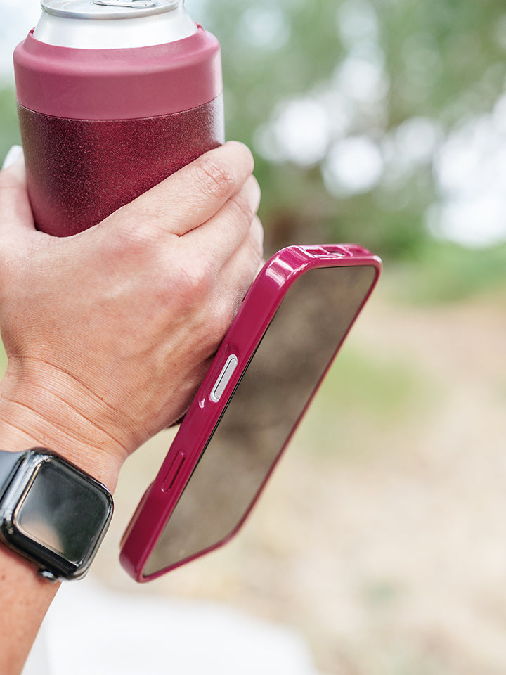 A woman holding a Dark Cherry Loopy Case. || feature-media