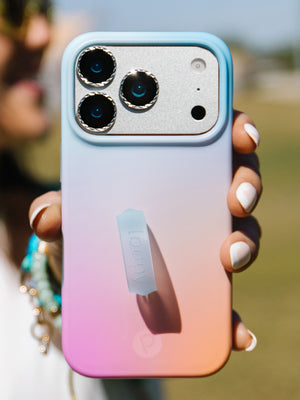 A woman holding a Daydream Blur Loopy Case. || feature-media
