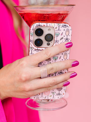 A woman holding a Fizzy Fun Cocktails Loopy Case. || feature-media