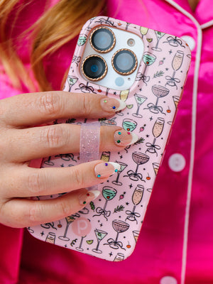 A woman holding a Fizzy Fun Cocktails Loopy Case. || feature-media