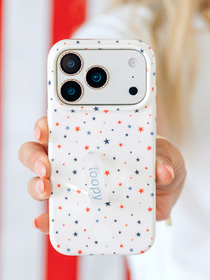 A woman holding a Freedom Stars Loopy Case. || feature-media