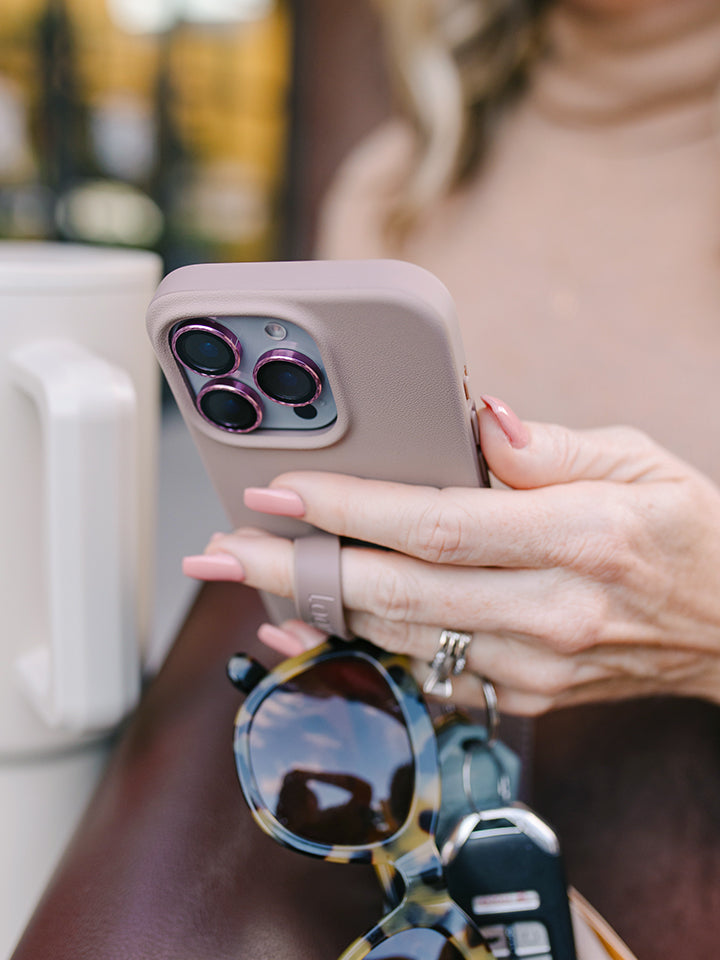 A woman holding a Stone Loopy Case. || feature-media