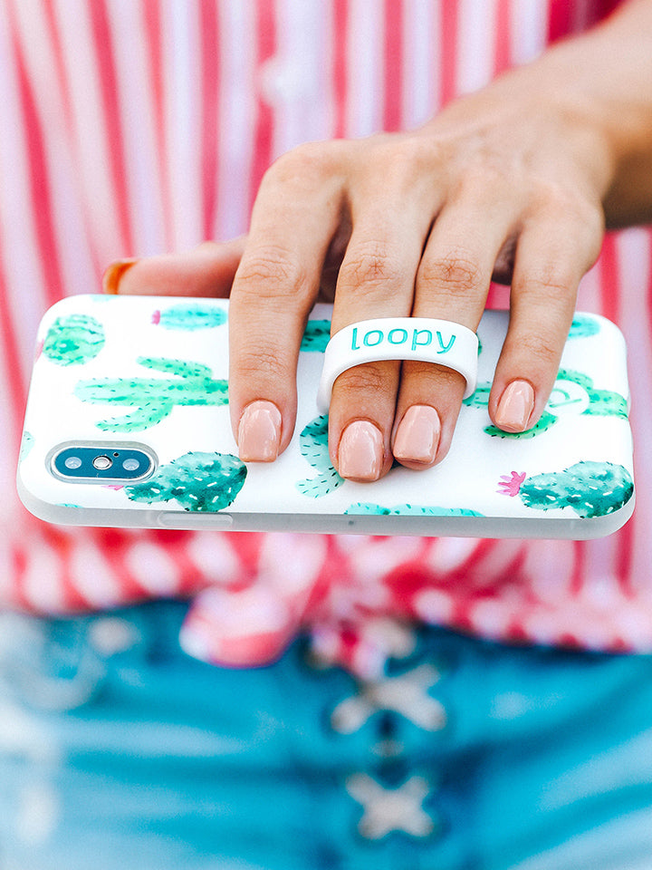  A woman holding a Cactus Loopy Case.