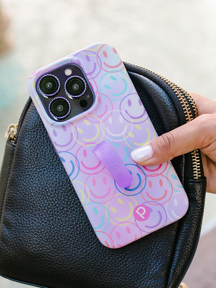 A woman holding a Smileys Loopy Case.