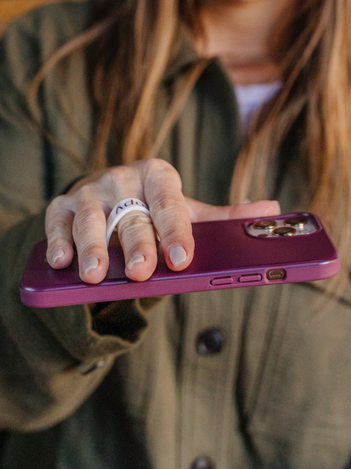A woman holding a Wine Loopy Case.  || feature-media