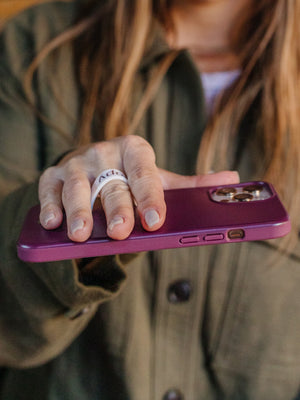A woman holding a Wine Loopy Case.  || feature-media