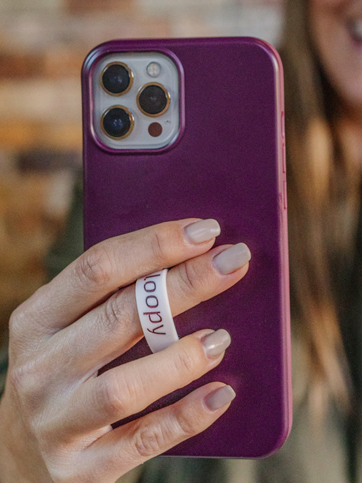 A woman holding a Wine Loopy Case.  || feature-media