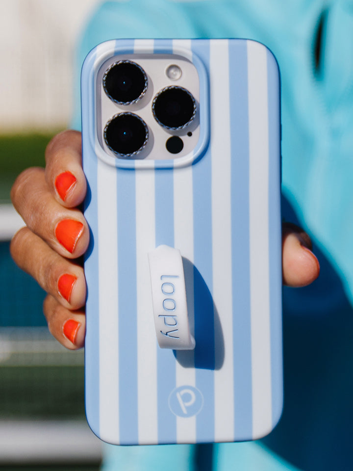 A woman holding a Blue Stripes Loopy Case. || feature-media