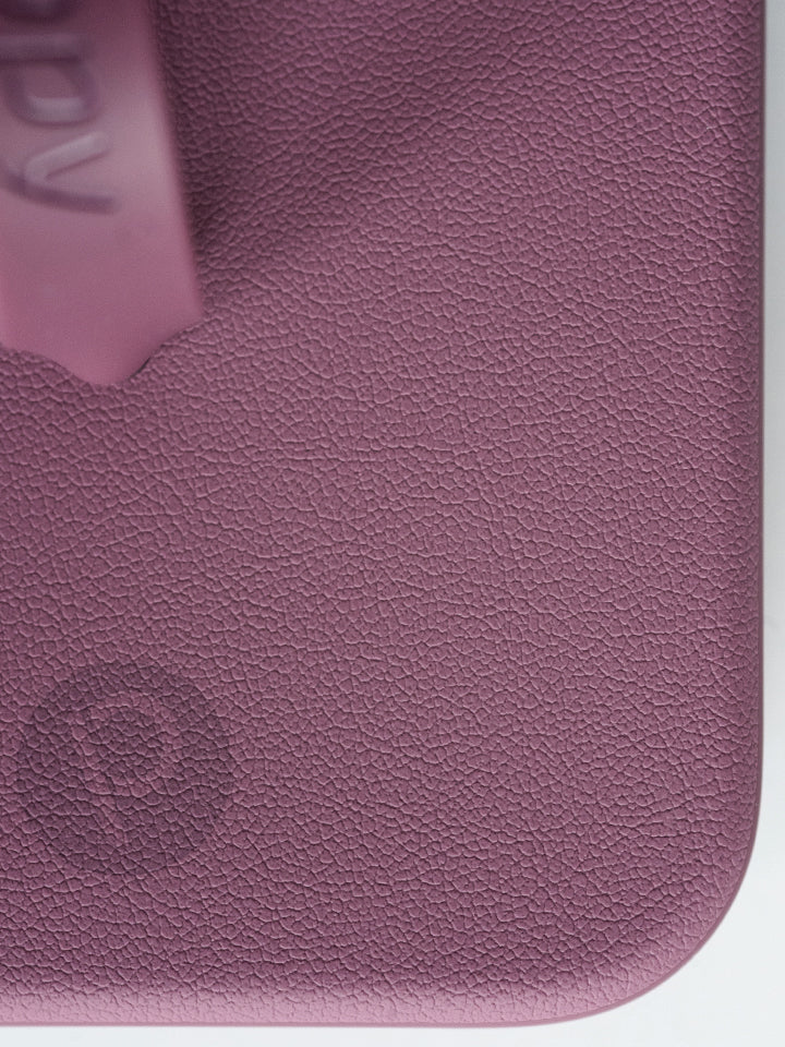 A close up of the pebble texture on a Dusty Plum Loopy Case. || feature-media