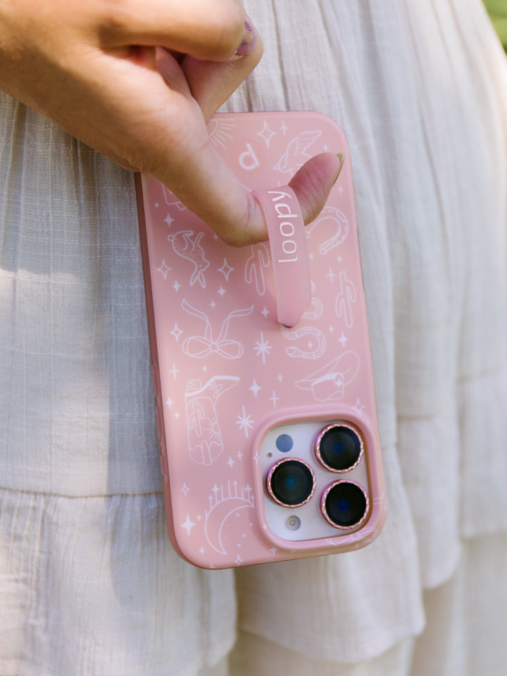 A woman holding a Cowgirl Charm Loopy Case. || feature-media