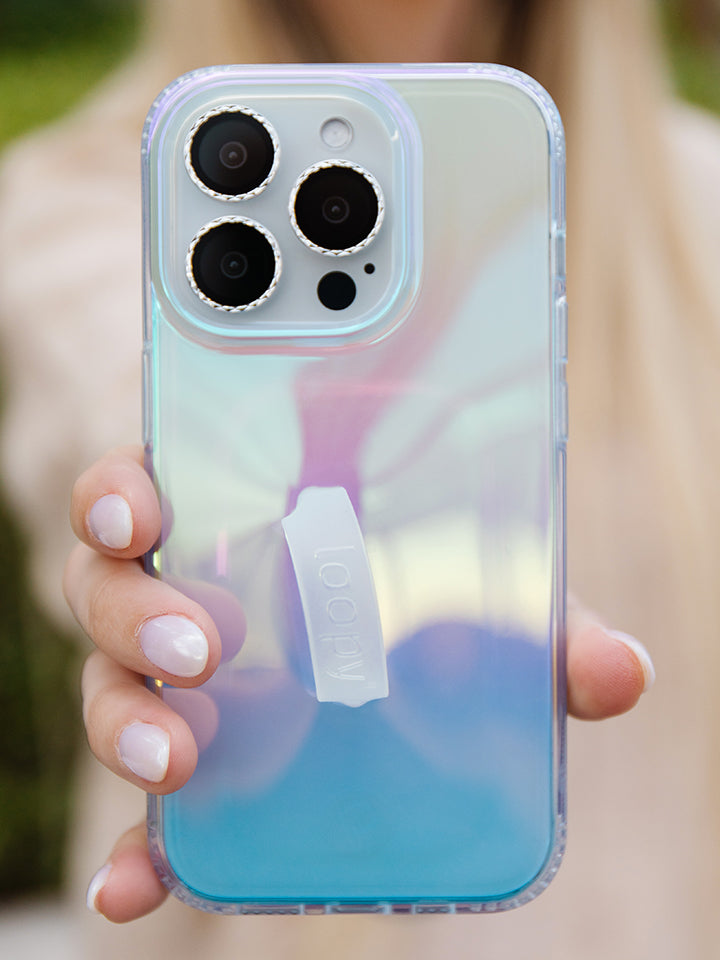 A woman holding a Clear Opal Loopy Case. 