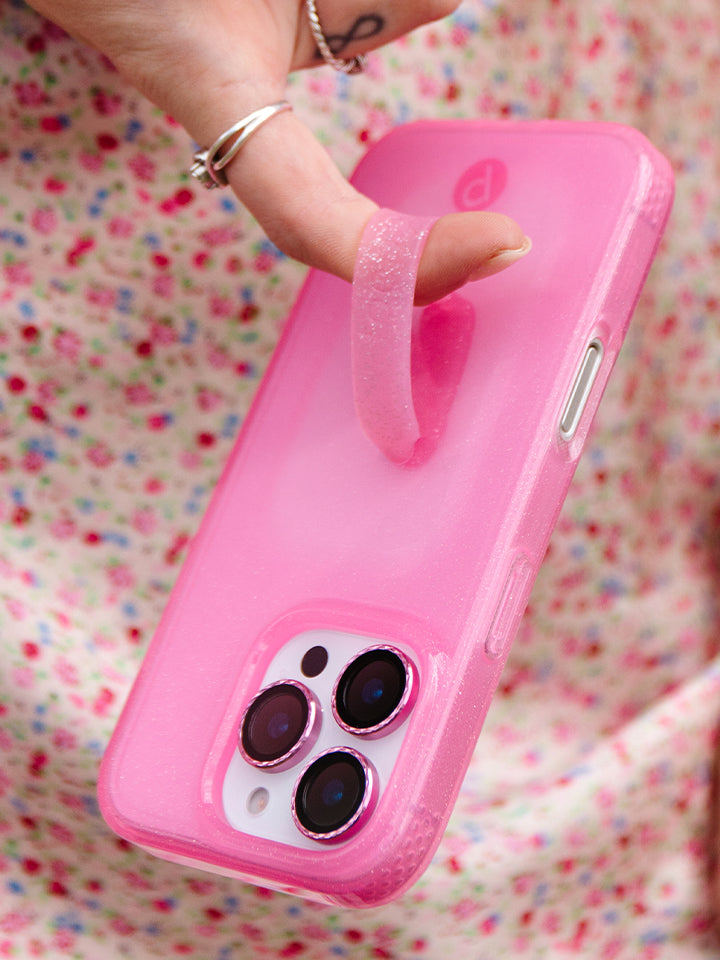 A woman holding a Clear Sparkle Pink Loopy Case. || feature-media