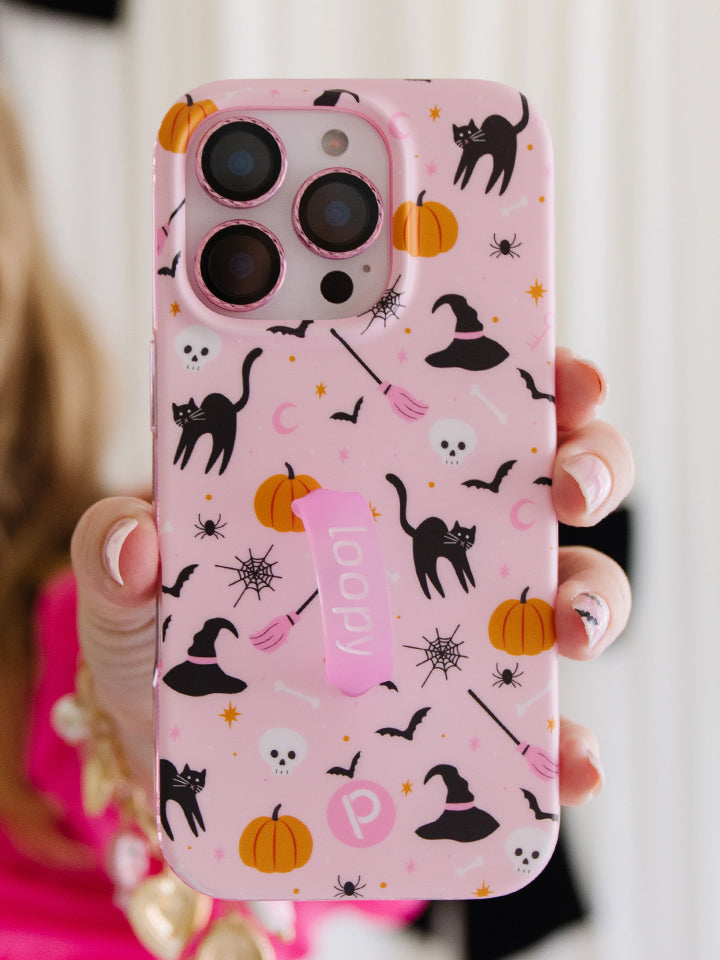 A woman holding a Witchy Wonder Loopy Case. || feature-media