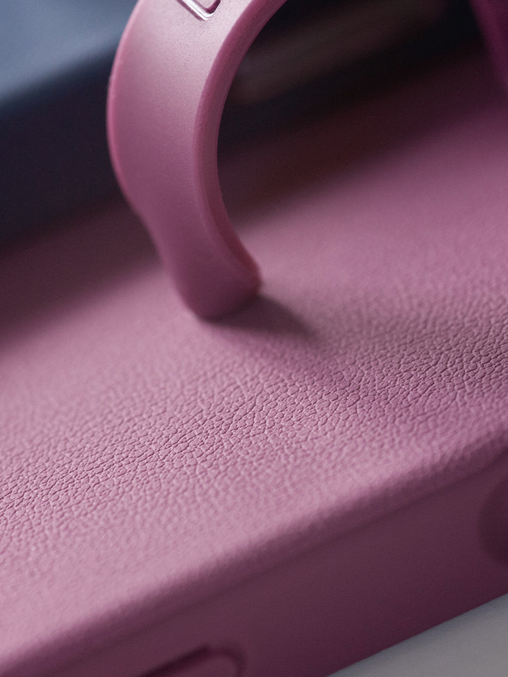 A close up of the pebble texture on a Dusty Plum Loopy Case. || feature-media