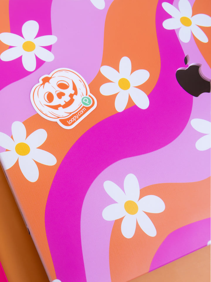 A sticker from the Loopy Cases Halloween Sticker Pack on a laptop.