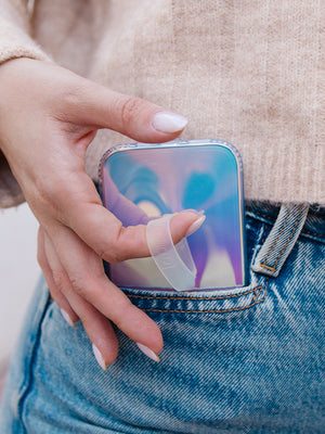 A woman holding a Clear Opal Loopy Case. || feature-media