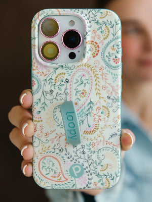 A woman holding a Painted Paisley Loopy Case. || feature-media