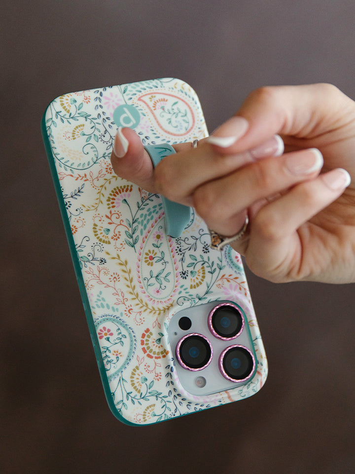 A woman holding a Painted Paisley Loopy Case.|| feature-media