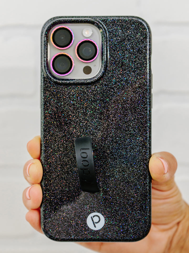 A woman holding a Sparkle Black Loopy Case.|| feature-media