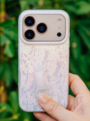 A woman holding a Sunkissed Shores Loopy Case. || feature-media