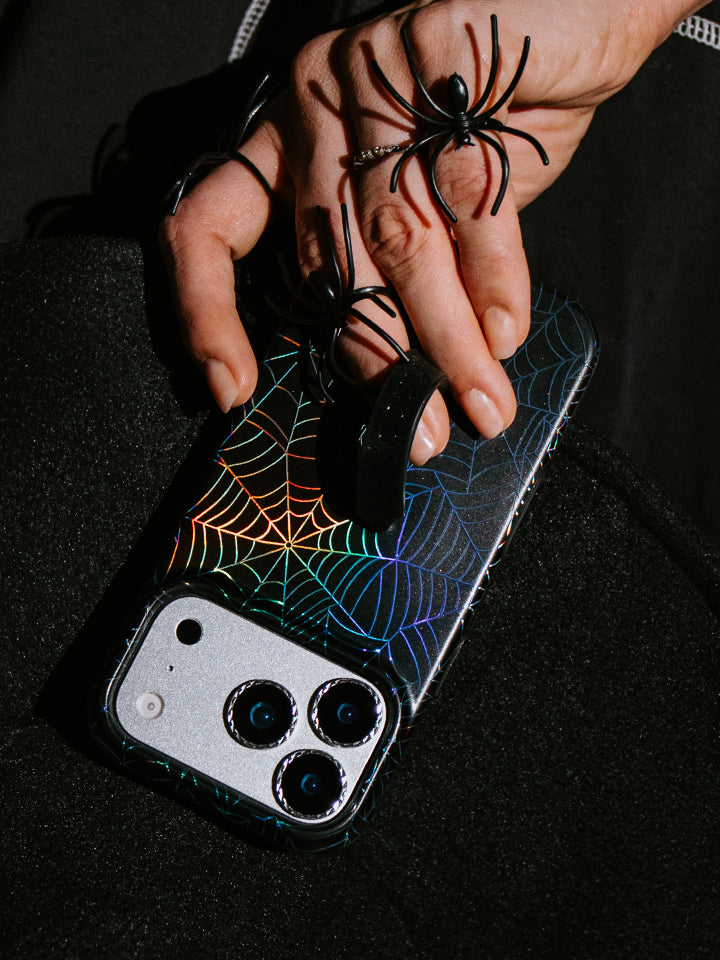 A woman holding an Itsy Bitsy Loopy Case. || feature-media