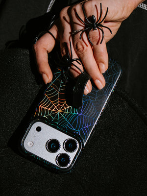 A woman holding an Itsy Bitsy Loopy Case. || feature-media