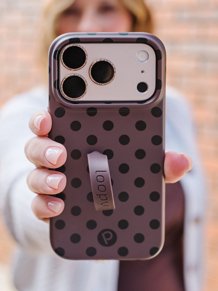 A woman holding a Java Dots Loopy Case. || feature-media