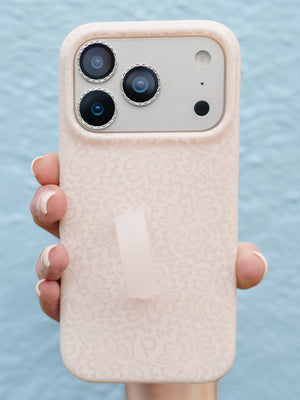 A woman holding a Lovely Lace Loopy Case. || feature-media