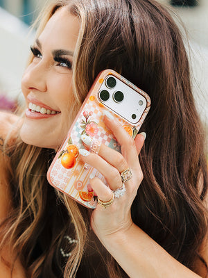 Amber Massey holding an Orange Blossom Loopy Case. || feature-media
