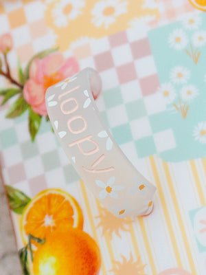 A close up of the design on the loop of an Orange Blossom Loopy Case. || feature-media
