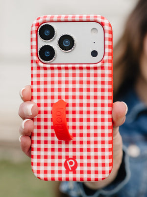 A woman holding a Picnic Check Loopy Case. || feature-media